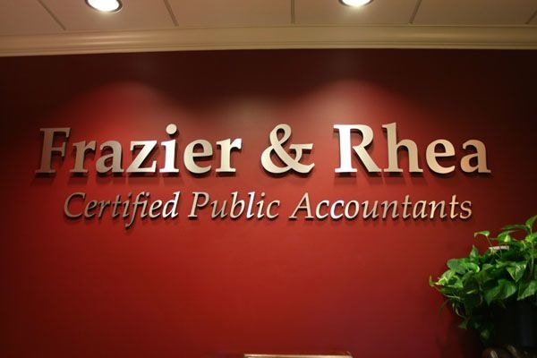 Frazier and Rhea dimensional reception sign with spacers to bring off the wall
